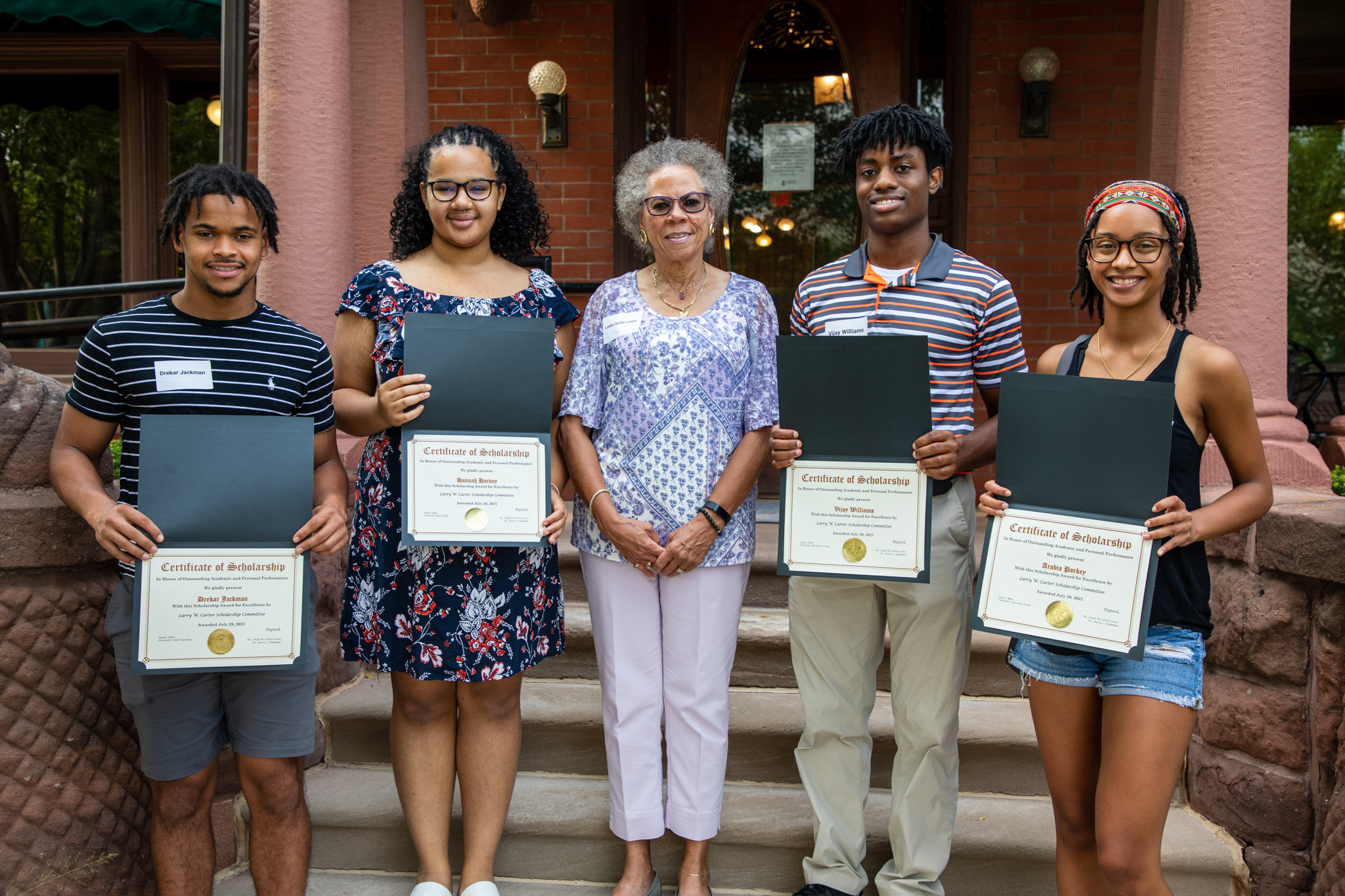 Students holding certificates